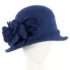 Blue felt winter hat with flower by Max Alexander