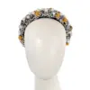 Multicolor pearl headband by Cupids Millinery